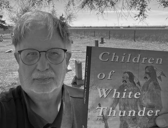 Dee Cordry holds his newest book which documents 190 years of Cheyenne history. Photo provided.