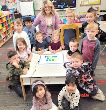 Pre-K students use their new light desk bought with a CLASS Grant awarded to teacher Amanda Haney at Riverwood Elementary School. Sitting criss-cross in the front: Jentry Fincher and Mia Huynh. On their knees around the table from left, Eric Ballin Martinez, Solara Hakala, Kasen Moss, Madison Scott, Theodore Glendenning and John Gober. Standing from left, Andrew Matejcic, Emilio AguilarMejia, Mrs. Amanda Haney, Leo Duke, Parker Rowe and Teague Smith. Photo / Provided