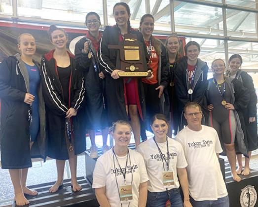 The Yukon girls swim team and coaching staff displays the academic state champion trophy at the state meet in Edmond last weekend. Photo / Provided