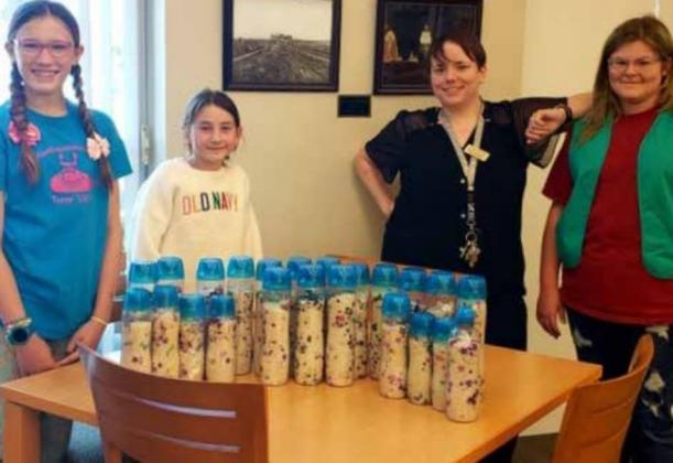 Members of Junior Girl Scout Troop 5309 show the sensory bottles they created for their Bronze Award Project. Photo provided.
