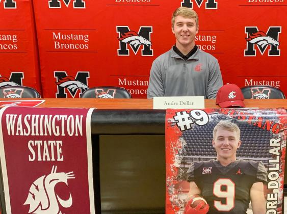 Mustang’s Andre Dollar signed his national letter of intent Dec. 15 at the Mustang Event Center. The senior intially committed to the University of Oregon, but after coaching changes, signed with Washington State. Photo / Provided