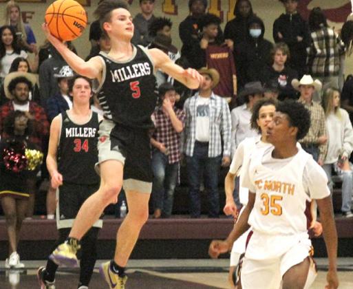 Yukon point guard Dylan Snow gets a shot off at the end of the first quarter in the Miller’s season ending loss to Putnam City North Tuesday night. Photo / Michael Pineda