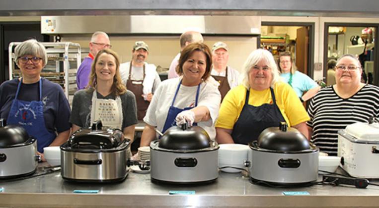 There were three shifts of volunteers to ensure plates were filled at the 65th Annual Ground Hog Dinner Saturday. Pictured from left, Kristi Swink, Mallory Poplin, Jeri Poplin, Diane Barnard and Ginger Strong. Photo / Michael Pineda