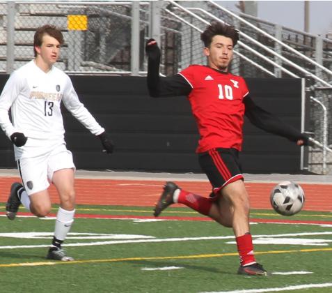Gilberto Velasco moves the ball downfield in the first half of a match against Stillwater Thursday. Velasco scored two goals to lead Yukon to a 4-1 win. Photo / Michael Pineda