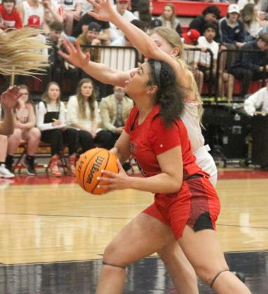 Mustang’s Talia Pogi runs into contact as she drives to the basket during the regualar season finale against Yukon. Photo / Michael Pineda