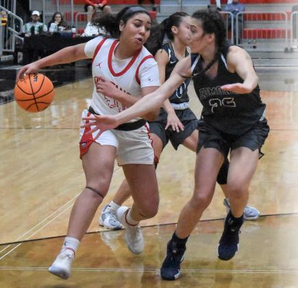 Mustang’s Karley Johnson drives to the basket against Edmond North in the finals of the Cornerstone Classic Dec. 29, 2021 at the Event Center. The Lady Broncos lost 52-45. Photo / Michael Kinney