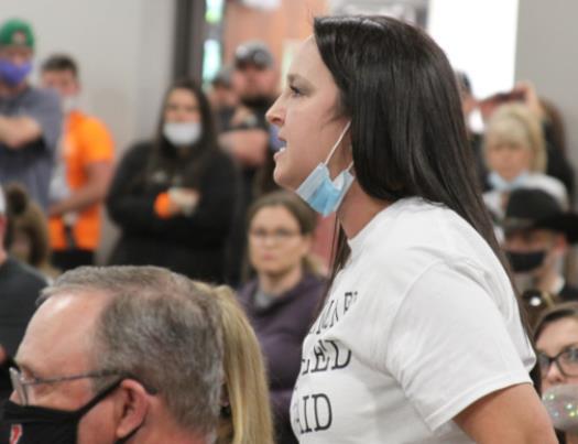 A woman speaks up on behalf of giving the parents the right to decide whether their children should wear a mask during the Yukon School Board meeting Monday. Photo / Michael Pineda