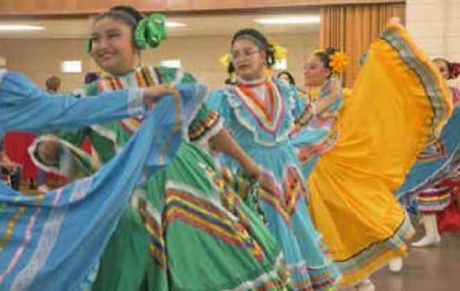 Latin American dancers entertain the crowd at the Cinco de Mayo fundraiser and festivities on May 5, at in the Education Building at the Old Fairgrounds, 220 N. Country Club Road in El Reno. Photos by Carol Mowdy Bond.