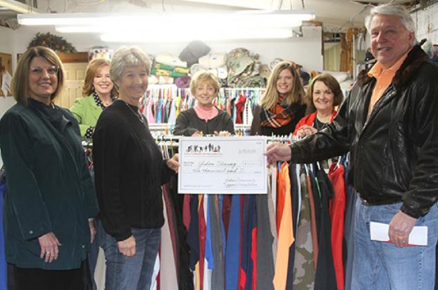 The Yukon Community Support Foundation presented a $10,000 check to Yukon Sharing. Pictured front, from left, Tammy Kretchmar, Missy King and Ray Wright. Pictured back from left, Rhonda Baker, Betty Korn, Kayleigh Ferguson and Pam Shelton. Photo / Michael Pineda