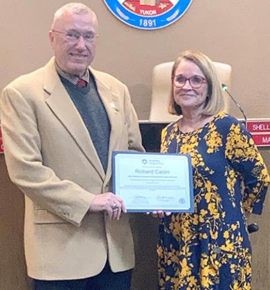 Vice Mayor Rick Cacini received a certificate of attendance for the 2021 Oklahoma Governor’s Symposium for Veteran Services from Mayor Shelli Selby during the Yukon City Council meeting Tuesday. Photo / Michael Pineda