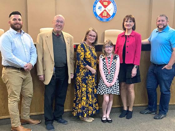 Savannah Smith led the Yukon City Council in a prayer and pledge of allegiance during its meeting Tuesday night. Pictured from left, Aric Gilliland, Rick Cacini, Shelli Selby, Smith, Donna Yanda and Jeff Wootton. Photo / Michael Pineda